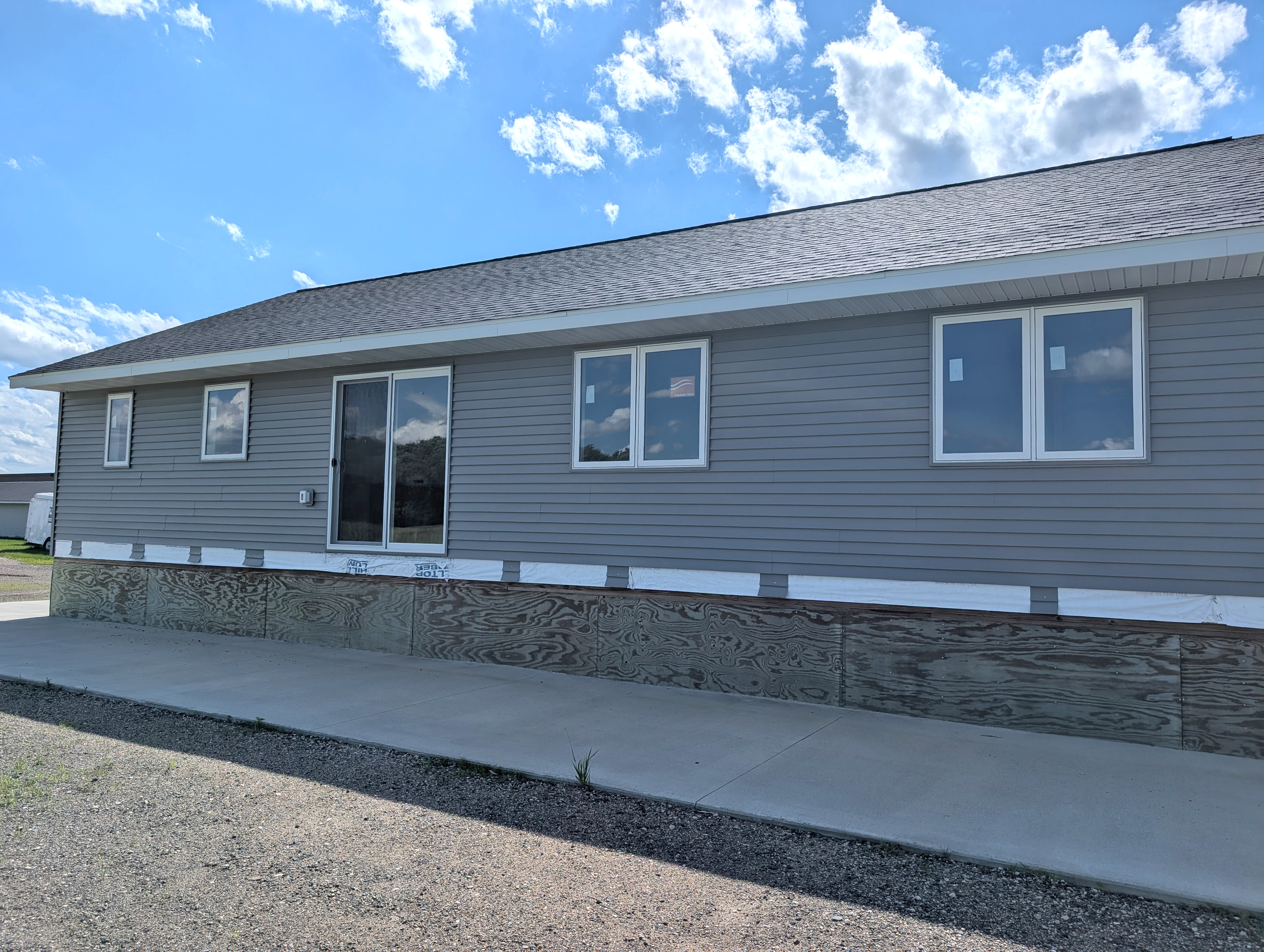 Rear of house with sliding patio door.