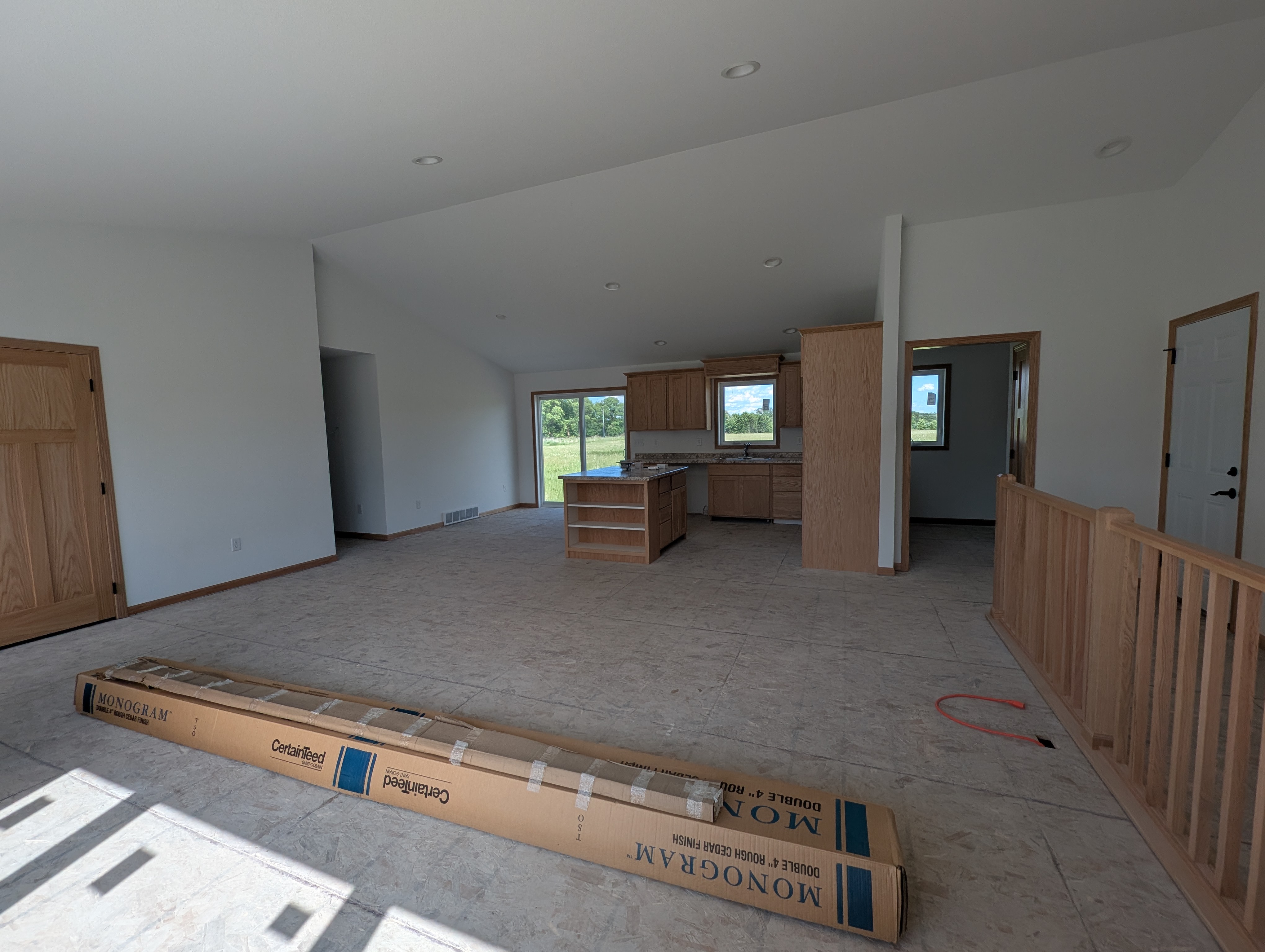 Open concept living room has two closets.