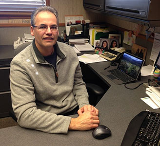 Randy Meyer sits at his desk at ITW Heartland