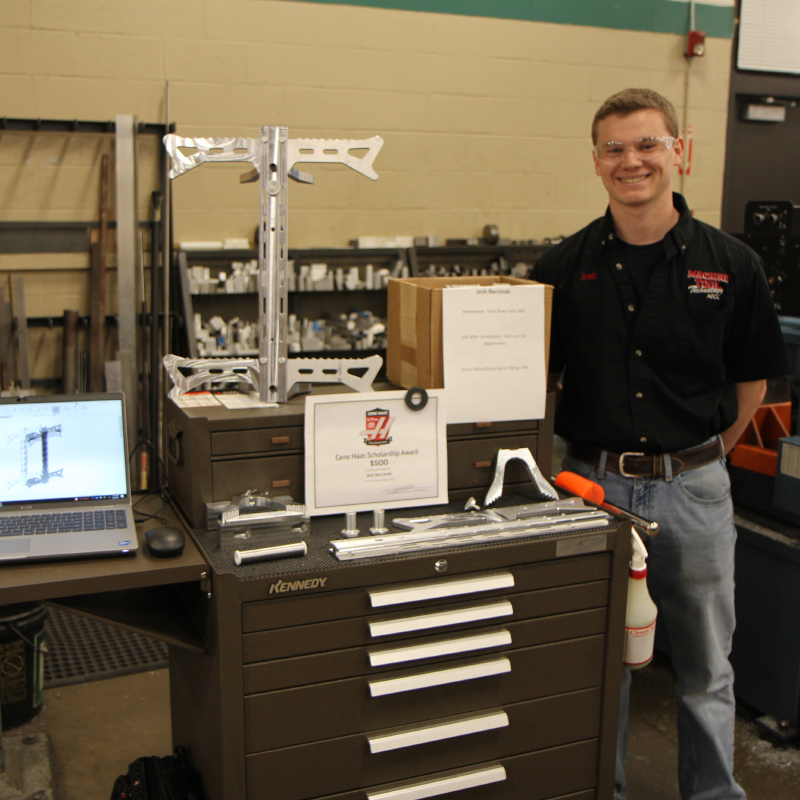 Machine Tool Student standing next to project